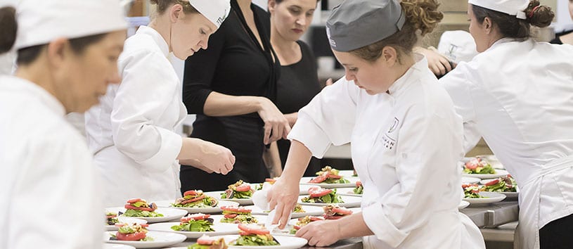 Bauman College students prepare dishes