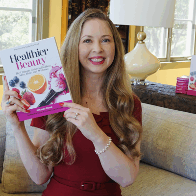 Bauman College Grad and Author, Jessica Rose holding a copy of her book, Healthier Beauty
