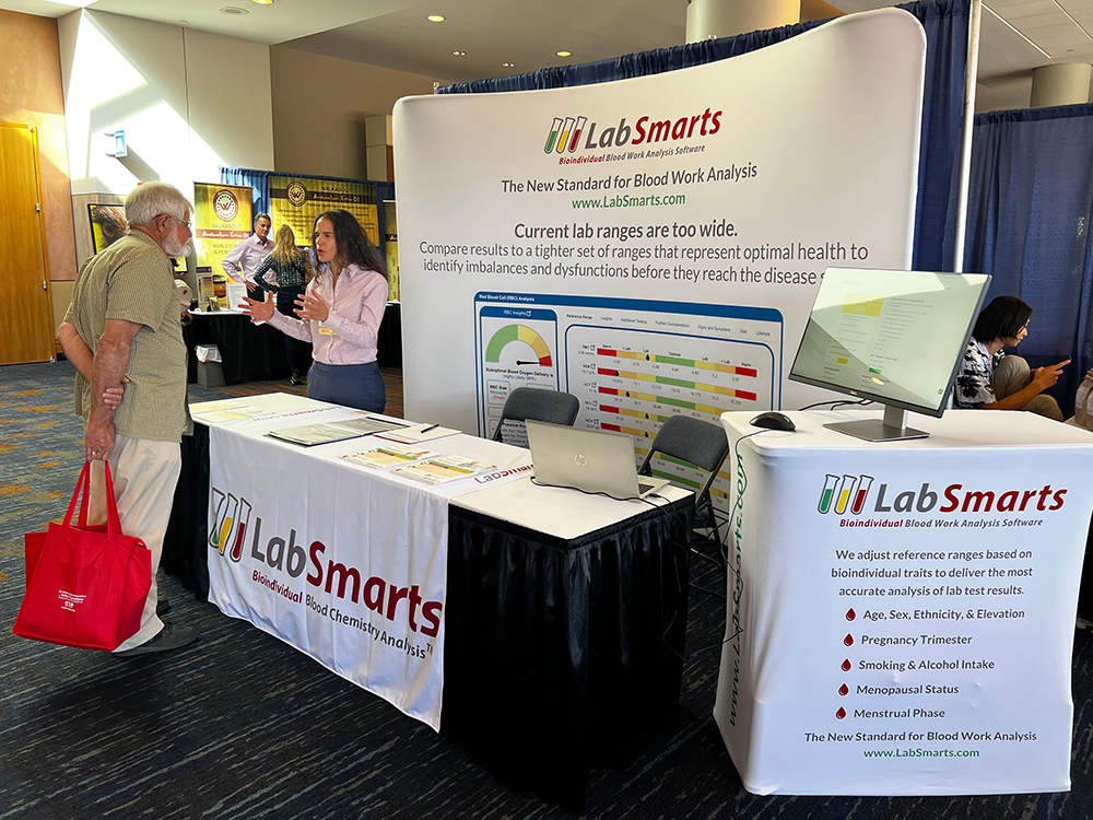 MaryAnn interacts with a visitor of the LabSmarts booth