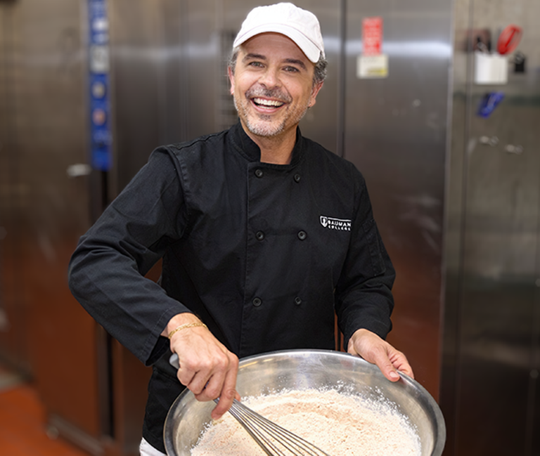 Male Chef and Bauman College Grad Jared Bailey in Kitchen
