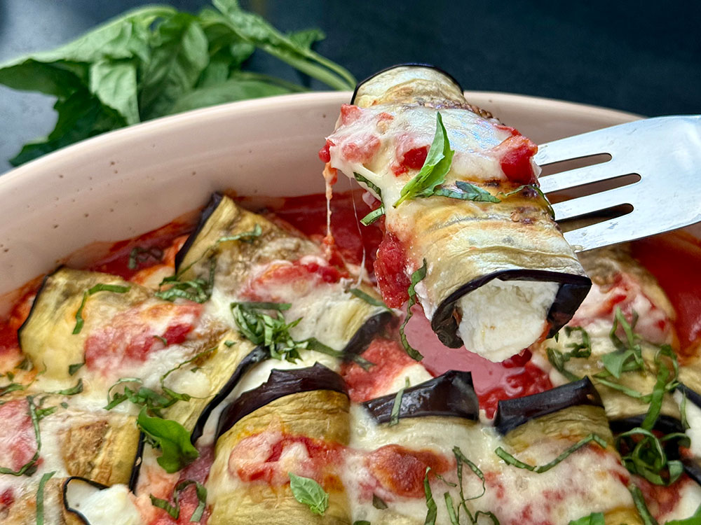 Baked Eggplant Rollatini on a fork by Bauman College Holistic Chef Teaching Assistant Michele Tedrick, NBC-HWC